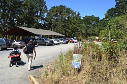 Gravel parking lot for a picnic area and fenced off-leash pet area – restroom Gravel parking lot for a picnic area and fenced off-leash pet area – restroom